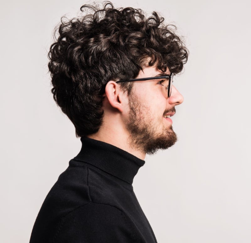 curly hair short men glasses profile