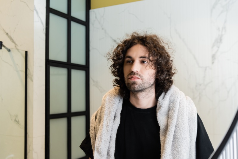 man curly hair mirror