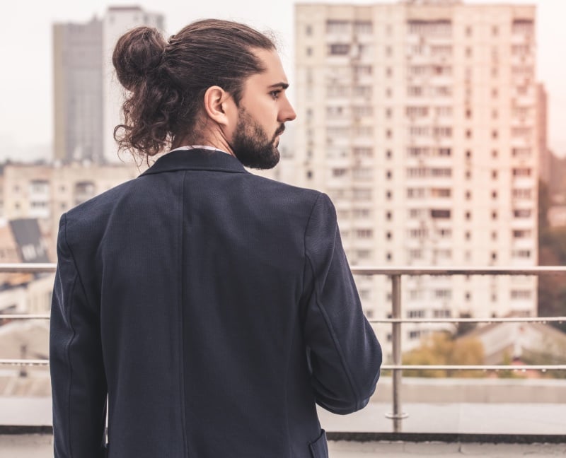 long curly hair messy man bun