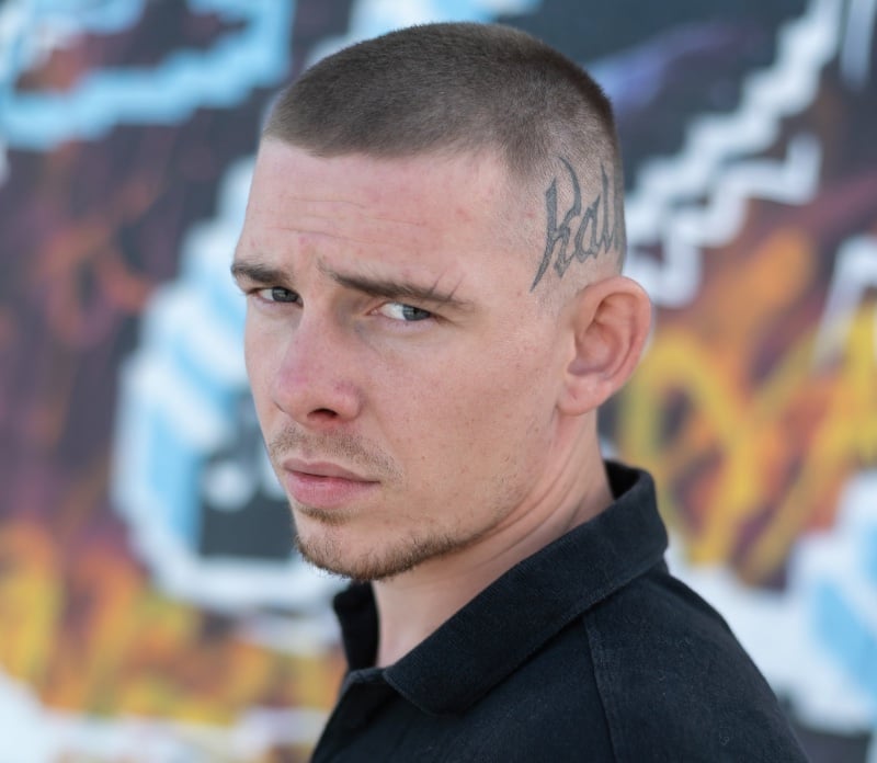 buzz cut fade with head tattoo