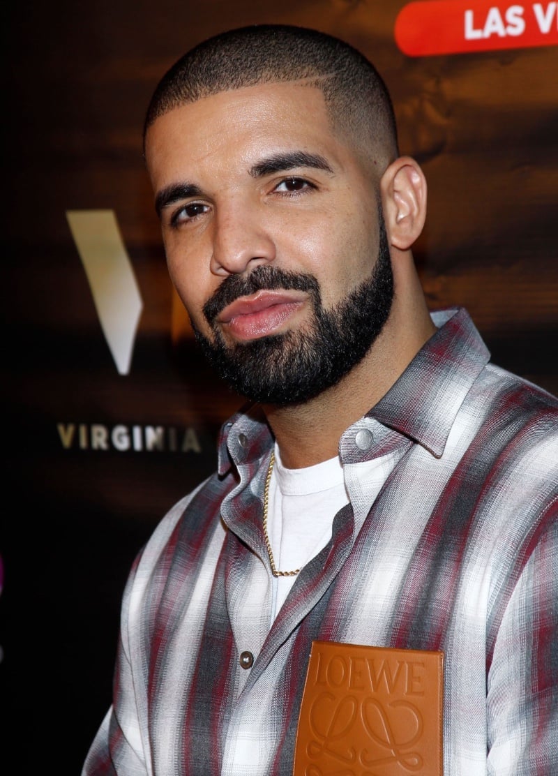 Drake with a buzz cut fade and shaved part