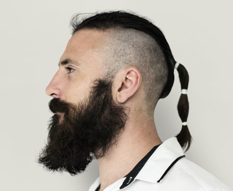 modern ponytail with shaved sides men