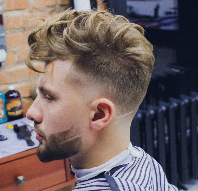 curly pompadour with taper fade