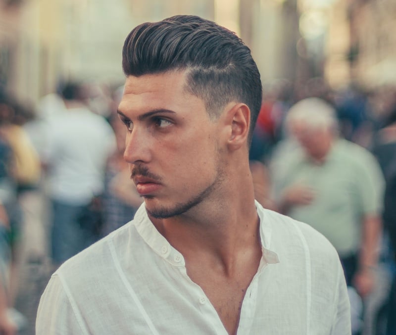 pompadour with side part and taper fade