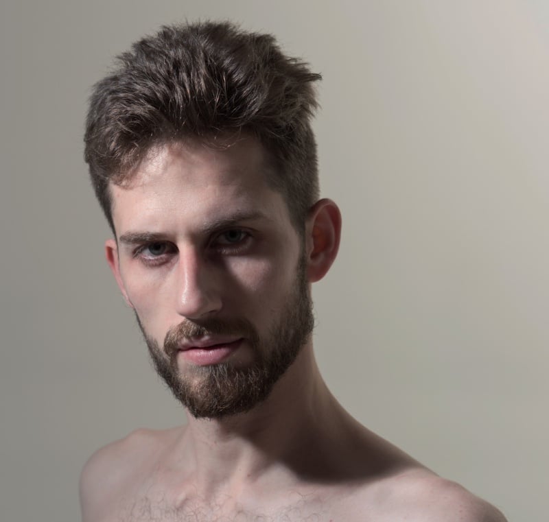 brushed back medium haircut men