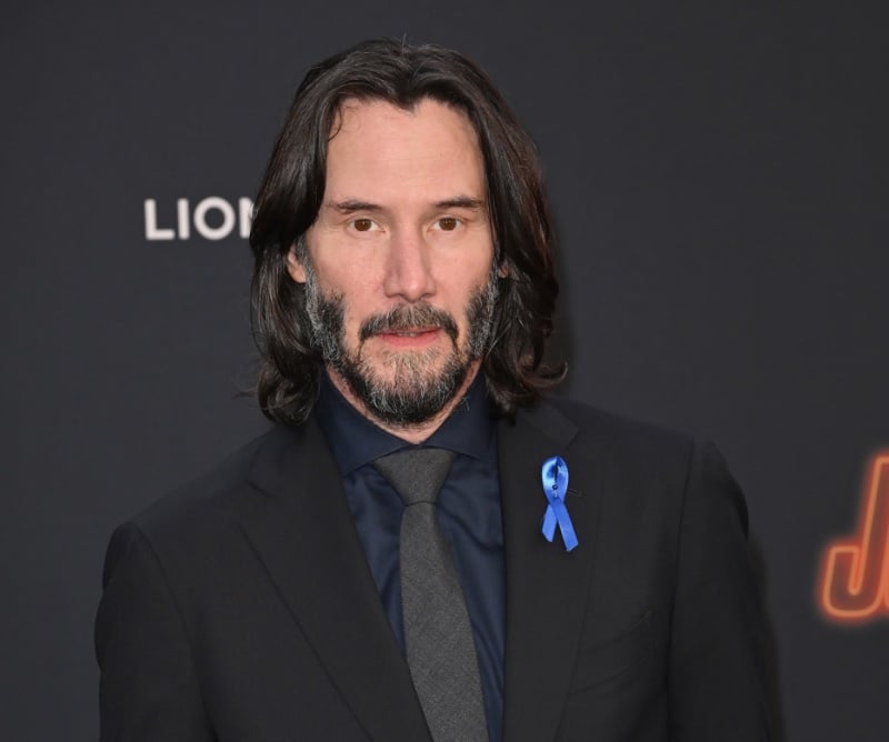 Keanu Reeves middle part hair