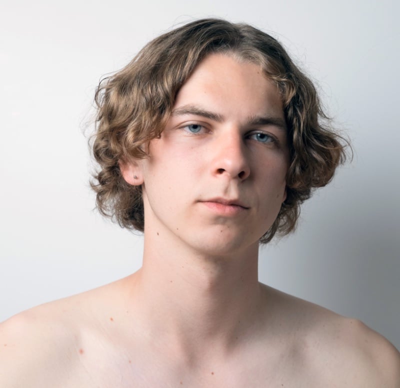 wavy middle part curtain hairstyle