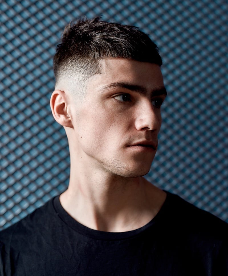 contemporary French crop with feathered fringe and mid taper fade