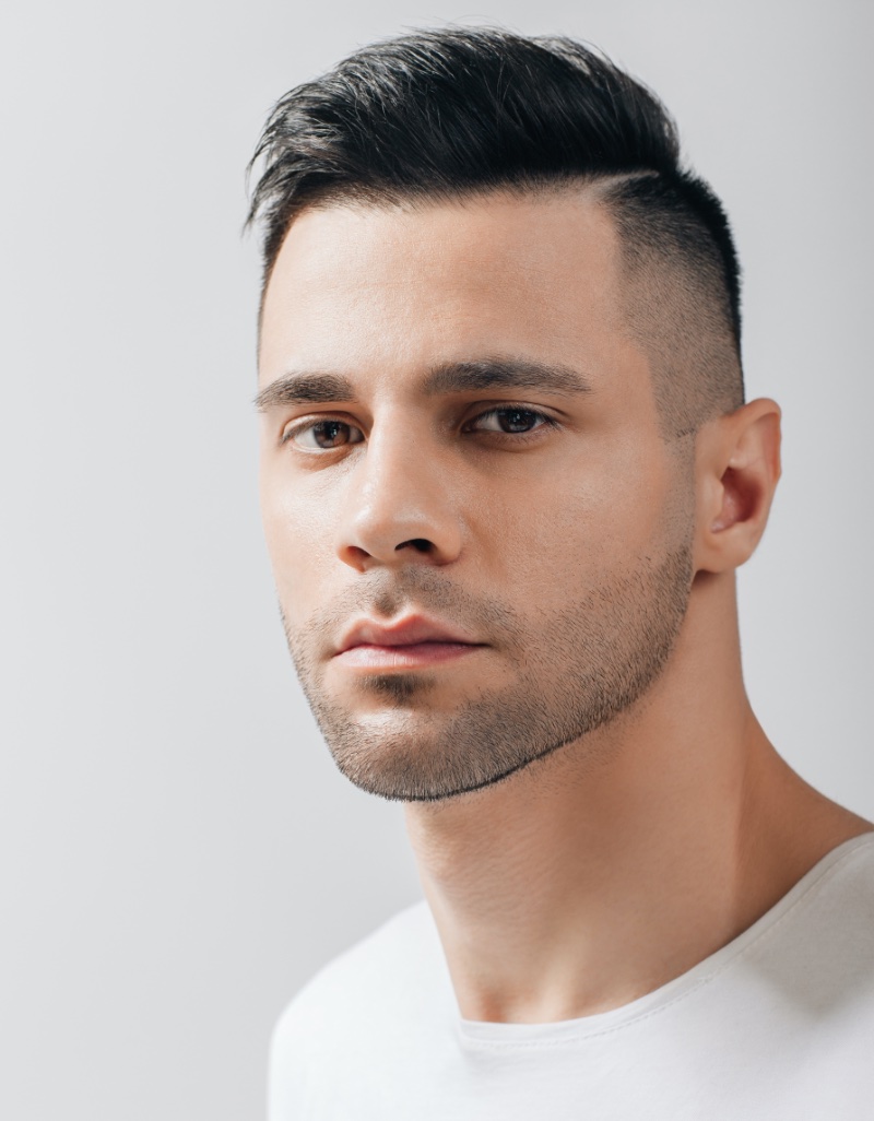 quiff with side part and high fade