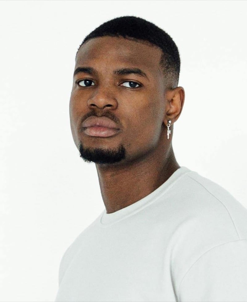 brush cut with line-up and low fade on a Black man