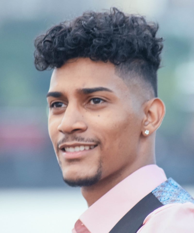 curly top mid skin fade