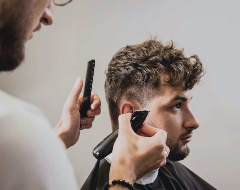barber cutting a man's hair