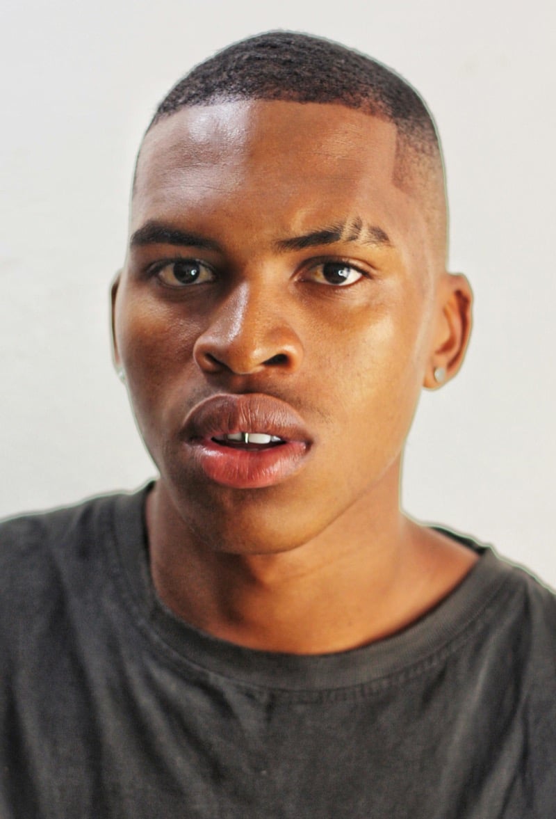 high fade buzz cut on a Black man