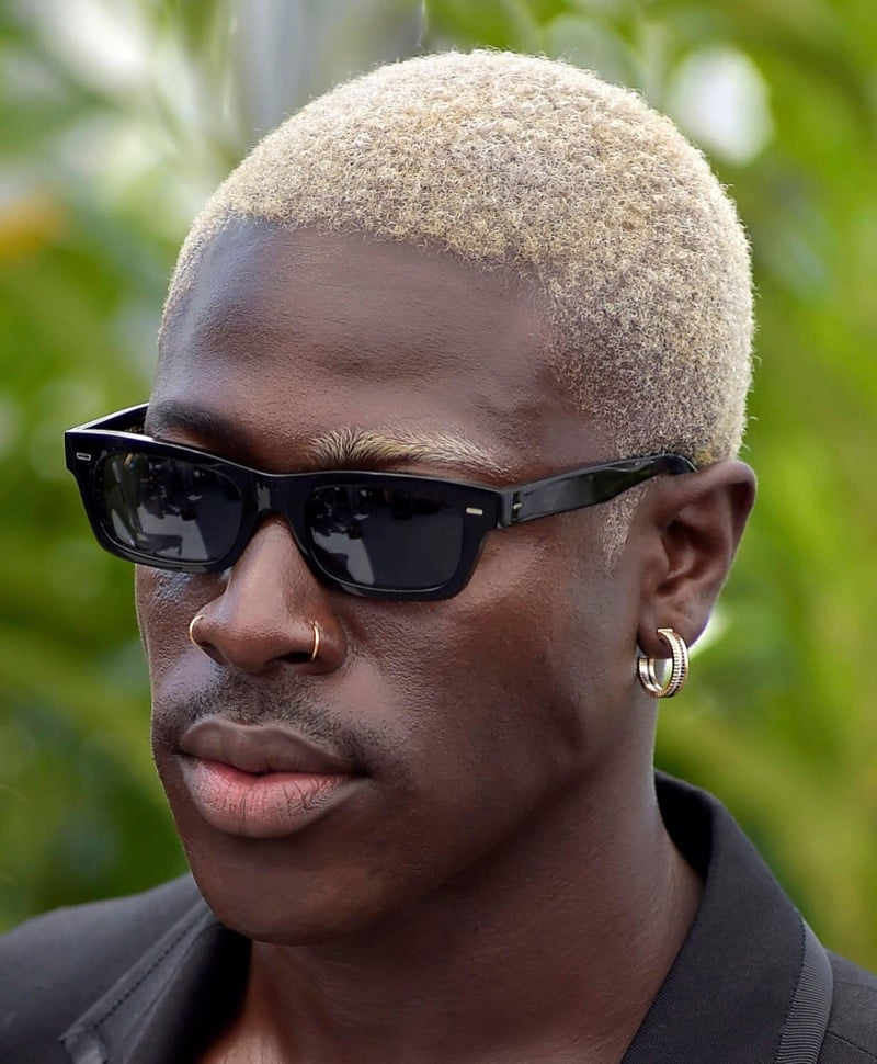 Moses Sumney with a platinum blonde buzz cut