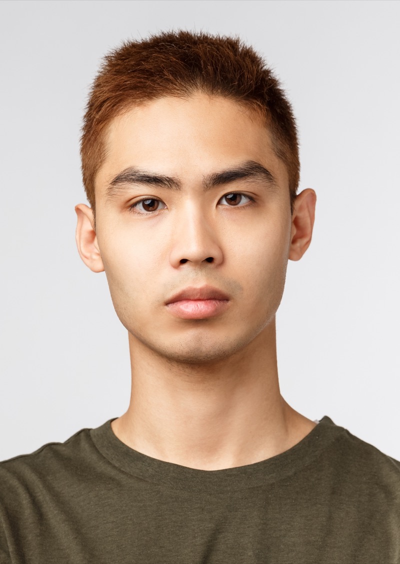 textured buzz cut Asian man