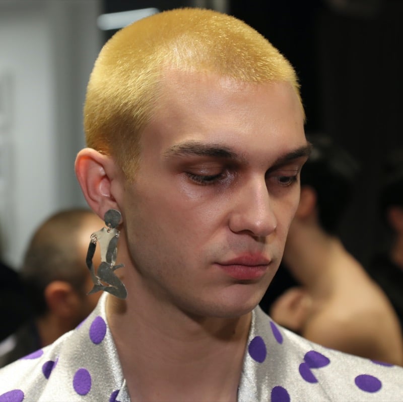 yellow-toned blonde buzz cut