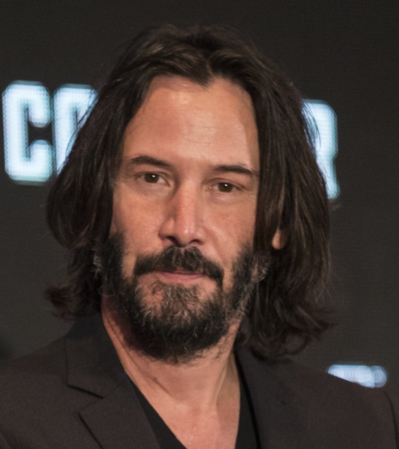 Keanu Reeves shoulder-length hair heart shaped face