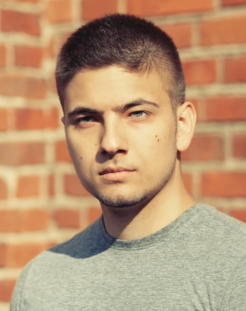 Latino man with a buzz cut and line-up