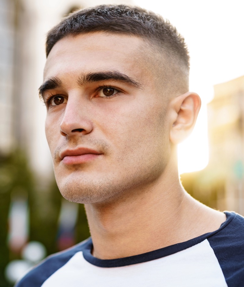 Man with a military crew cut and a high skin fade